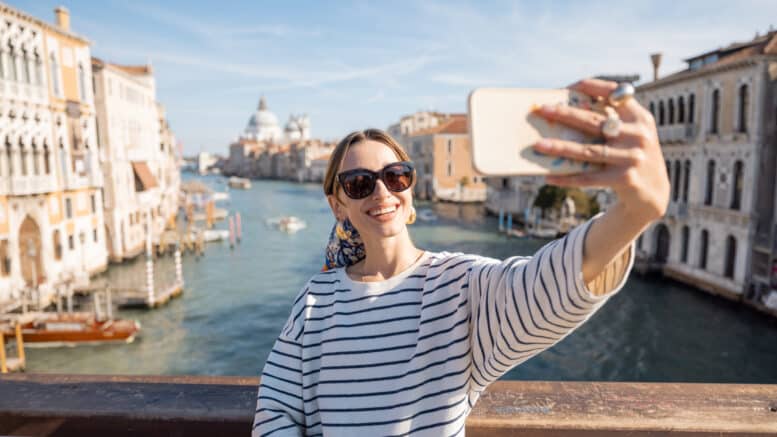 woman taking a selfie in Venice, Italy